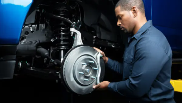 Technician working on brake system